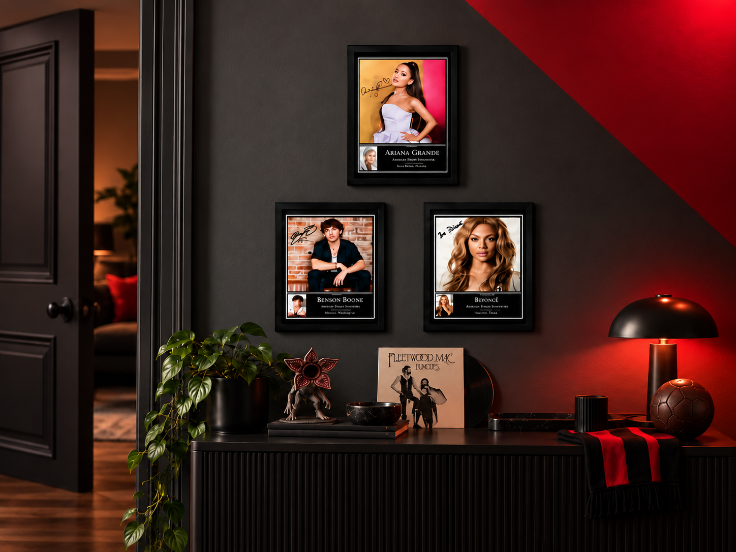 Three framed pop-culture prints displayed on a charcoal wall with subtle music and TV details